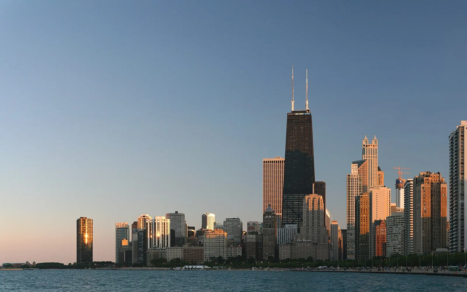 A city lakefront at golden hour