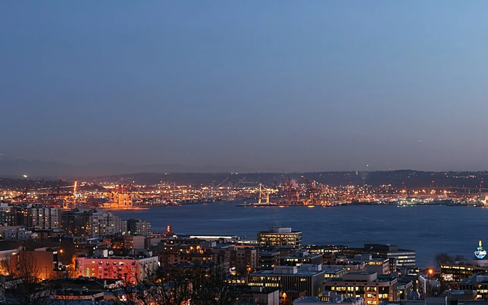 The Seattle skyline at night above Elliott Bay